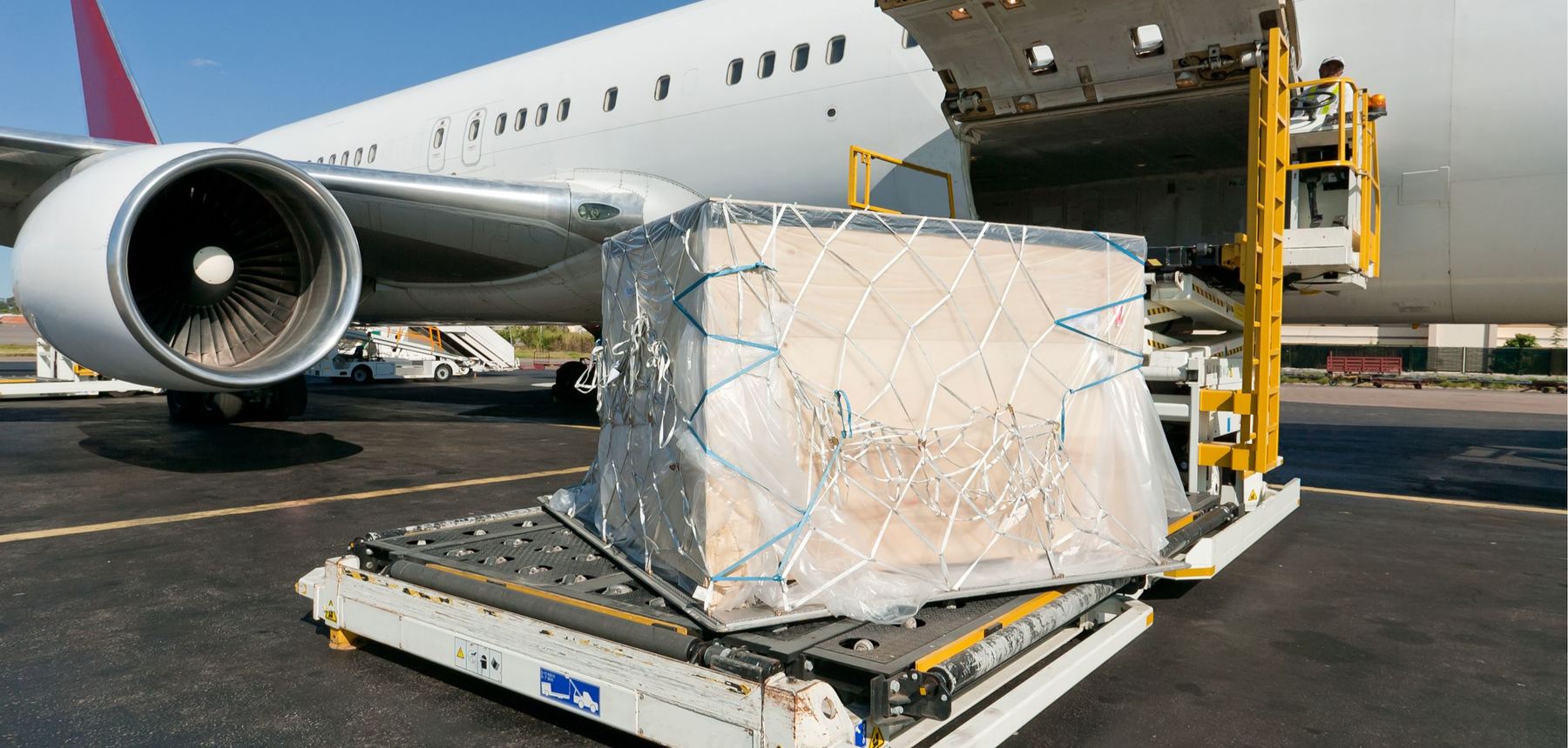 Air freight cargo being loaded for import into Australia